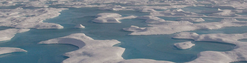 On a clear summer day, a series of interlocking melt pools show as beautiful aquamarine reminiscent of shallow tropical lagoons.