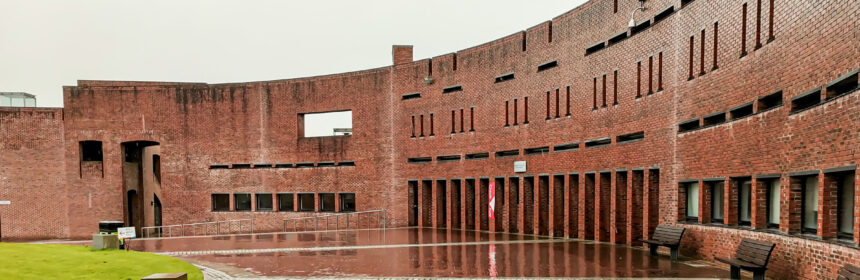 A part of an inner courtyard surrounded by a red brick building