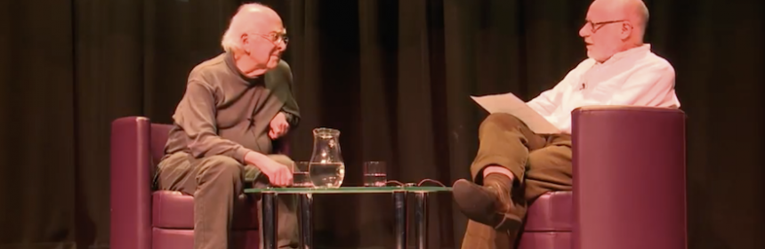 Peter Higgs seated opposite Dennis Canavan