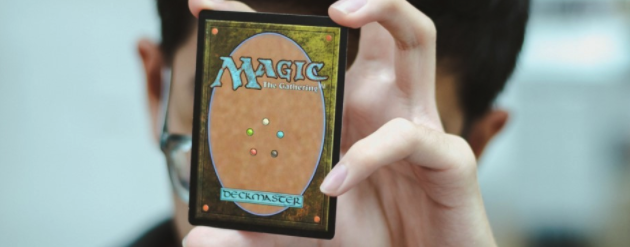 Hand holding a magic the gathering card