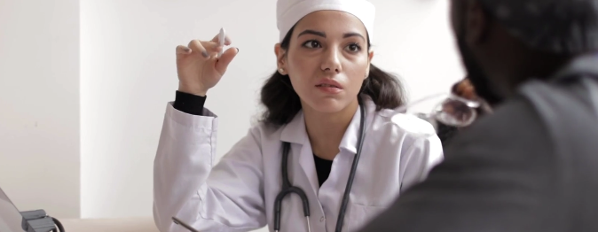 Woman doctor talking to a patient