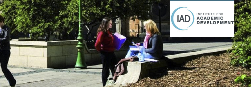 staff and students sitting outside a University