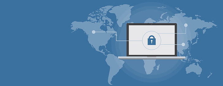 Map of the world superimposed by an image of a laptop with a lock on the screen.