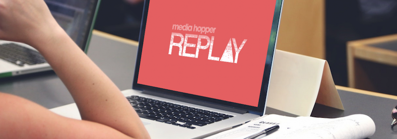 Laptop displaying the logo "Media Hopper Replay".