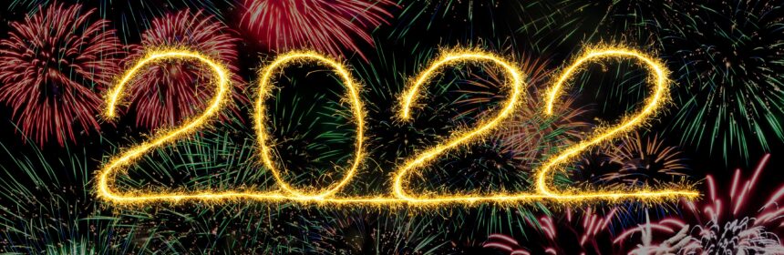 2022 in yellow lettering against a black background with fireworks